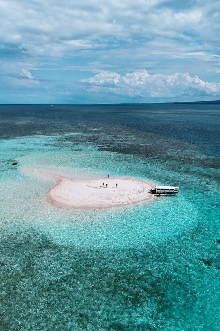 Small sandy island with clear water, Lombok Secret Islands
